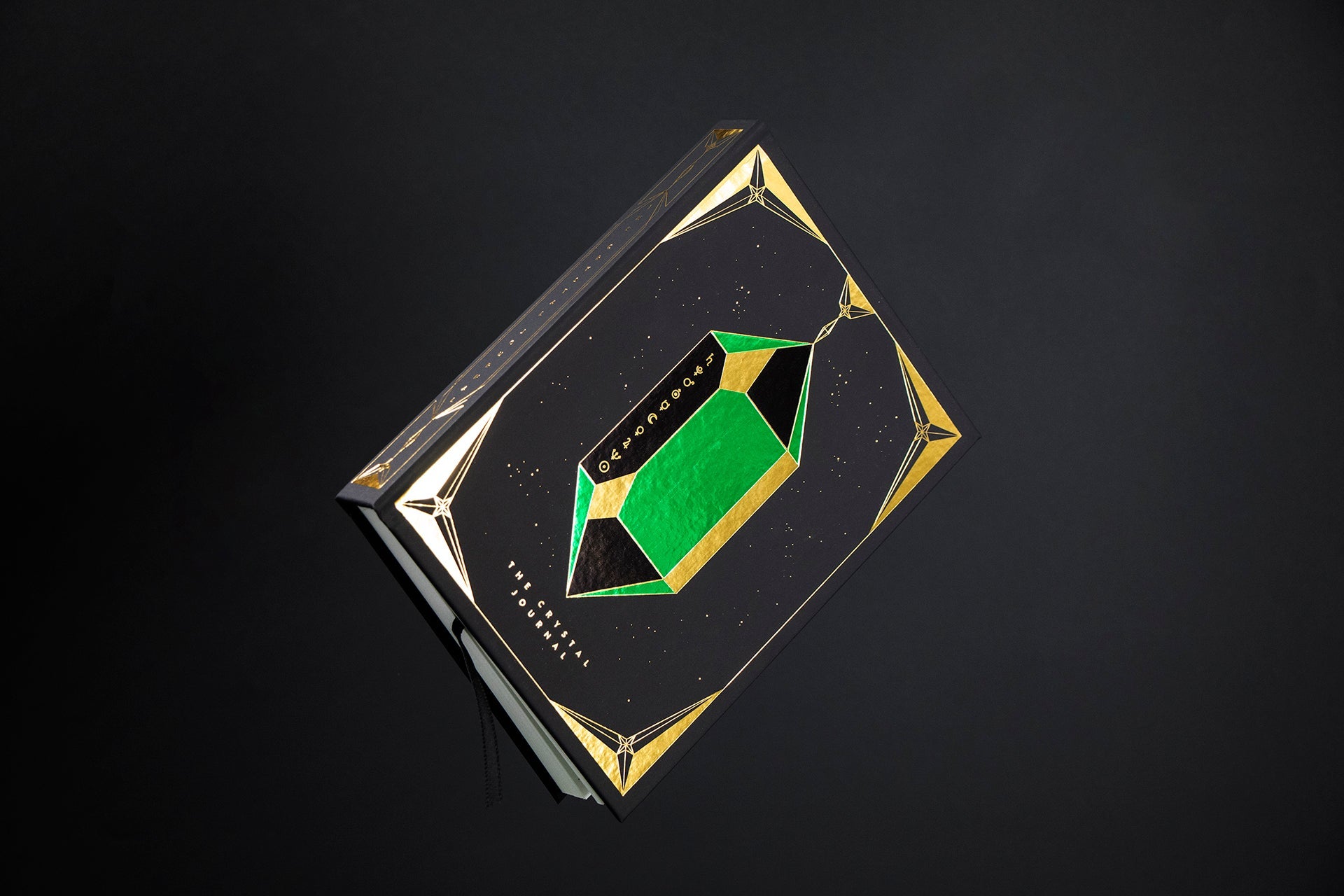 The Crystal Journal hardcover close-up with gold foil